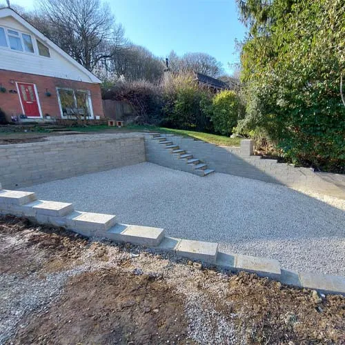 a concrete patio with steps leading up to it