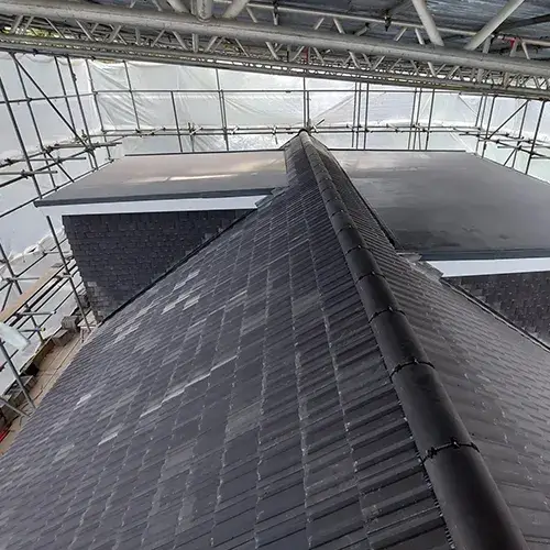 A very tall building with a metal roof.